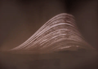 A monochrome solarigraph showing a series of stacked arcs - the sun's path over the course of 6 months - on the left the point at which the sun rises varies, the arcs are truncated a bit after their peaks in mid-afternoon.